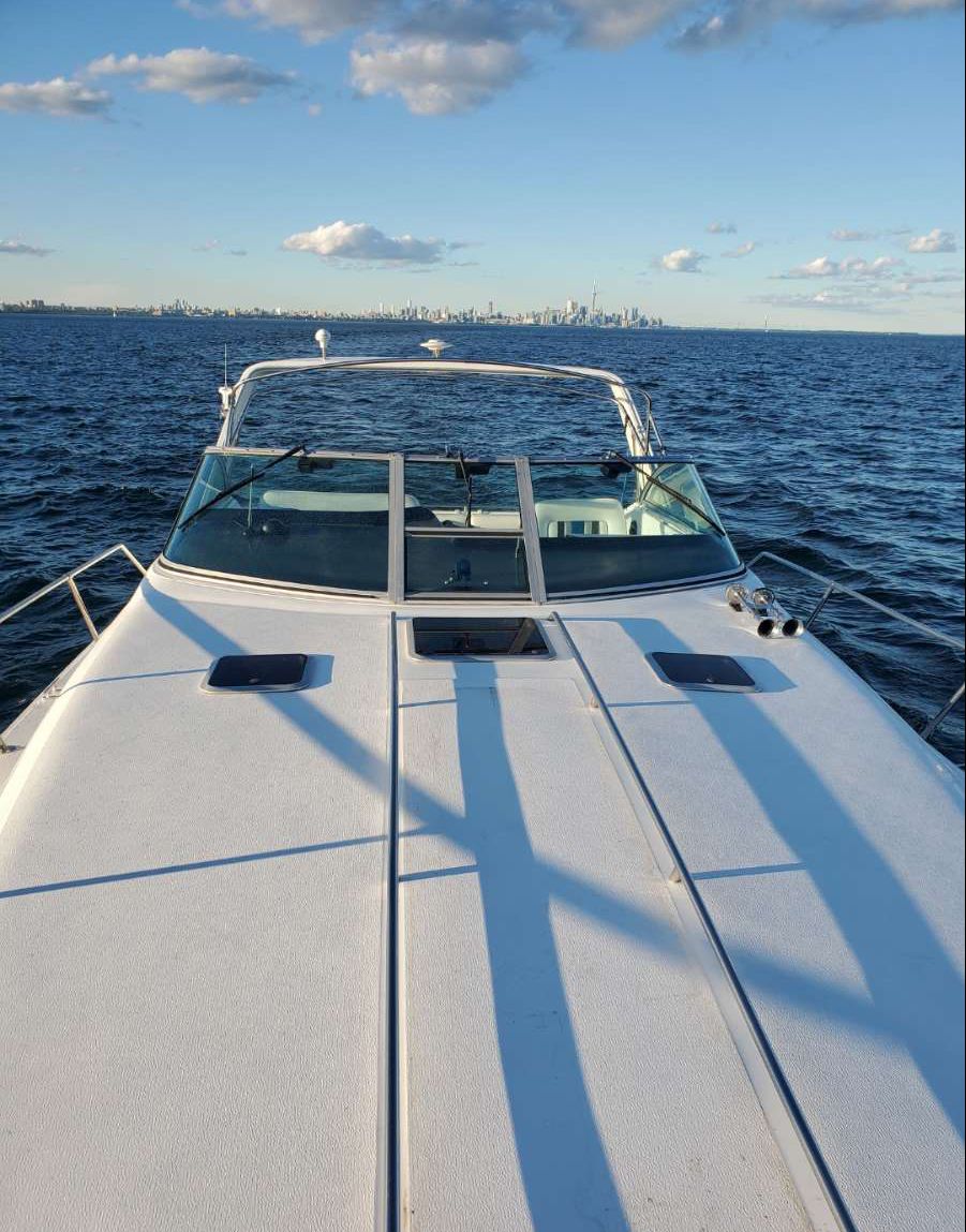 Large bow of the 40ft Sea-Ray Express with the Toronto skyline ahead