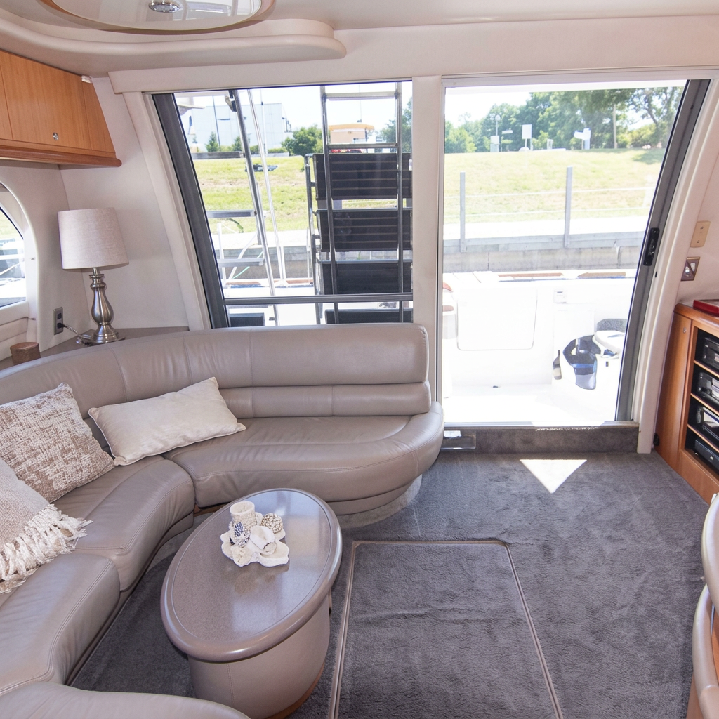Interior salon of the 44ft Maxum yacht with curved seating