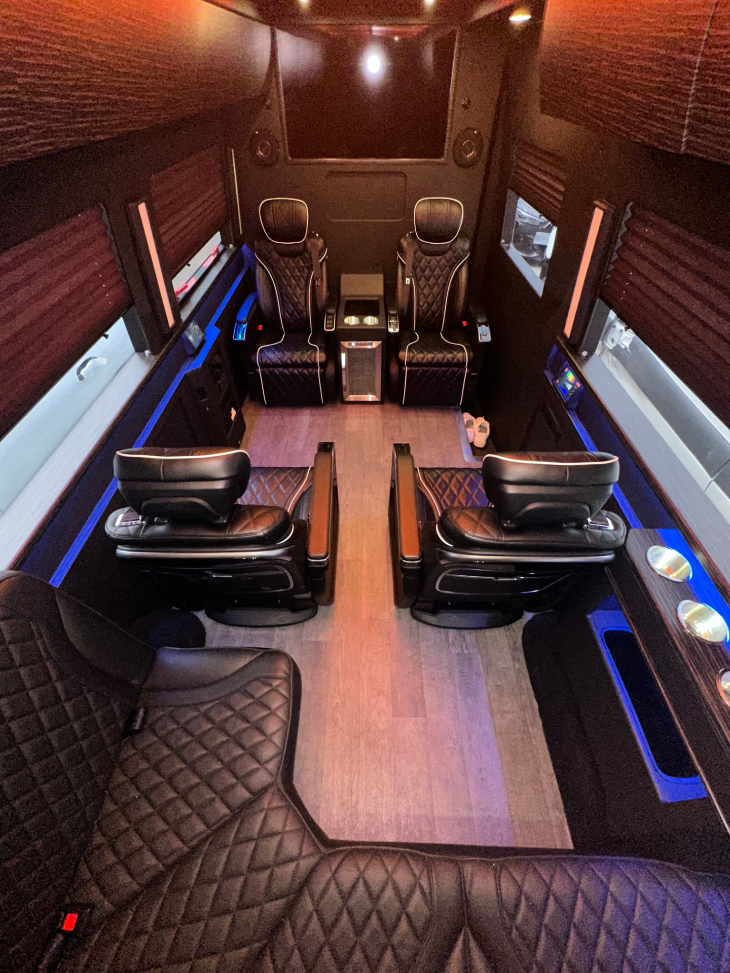 Sprinter interior with black quilted leather captain seating