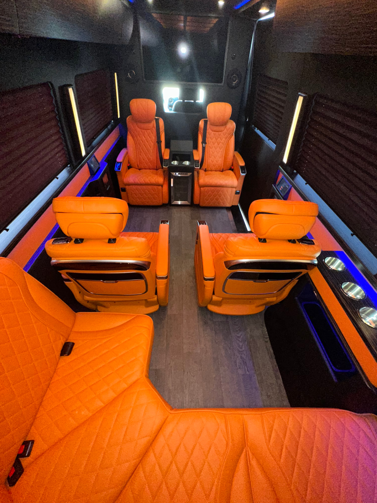 Sprinter interior with orange quilted leather captain seating