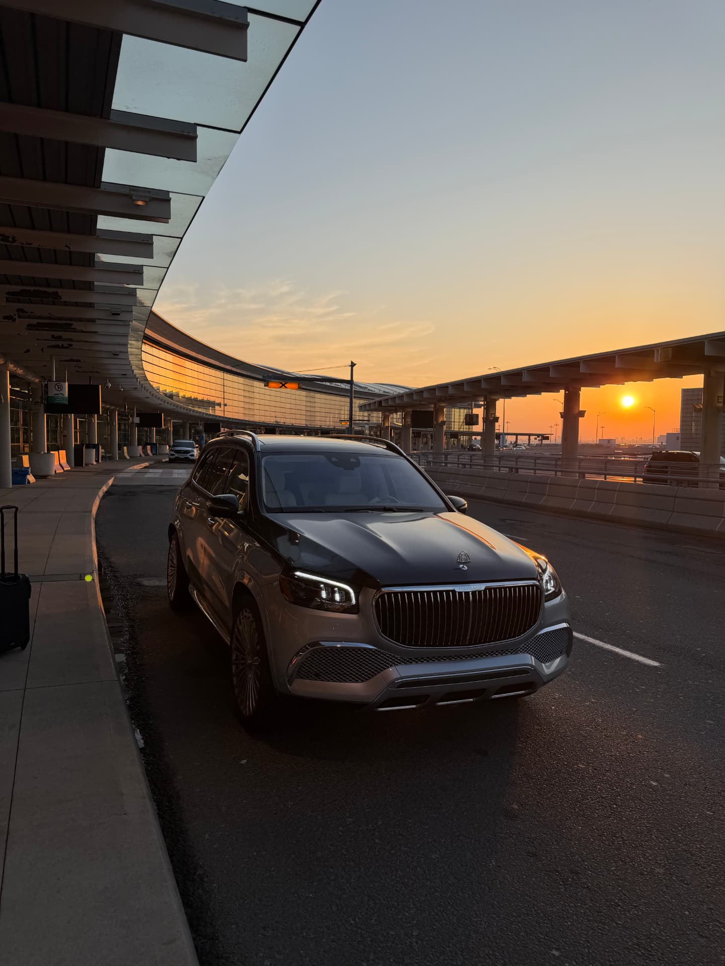 Mercedes-Maybach GLS600 chauffeur SUV at the airport terminal at sunrise
